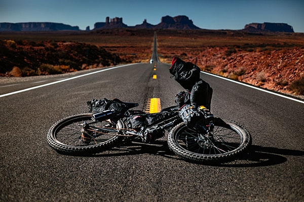 touring bike laying on the ground