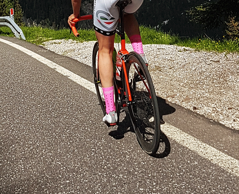 road biker with pink cycling socks