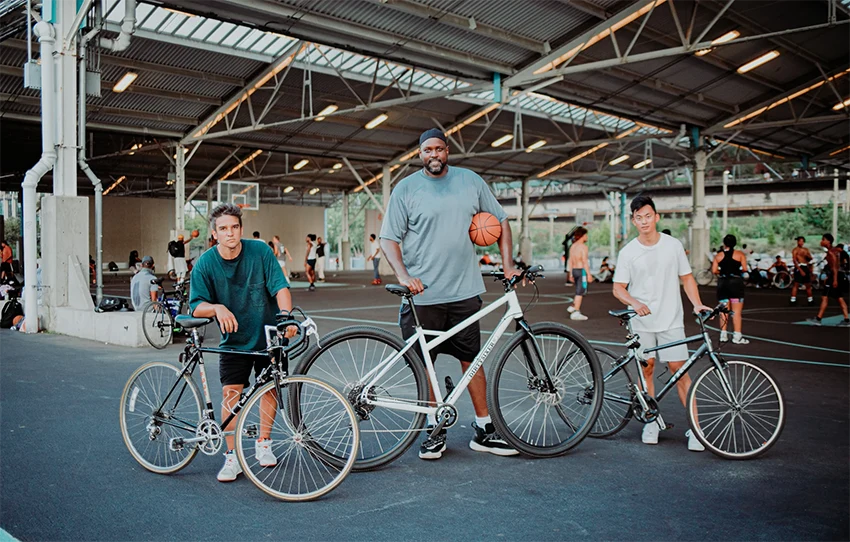 shaquille o'neal posing next to his 36" bike