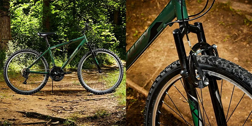 green huffy mountain bike in the forest