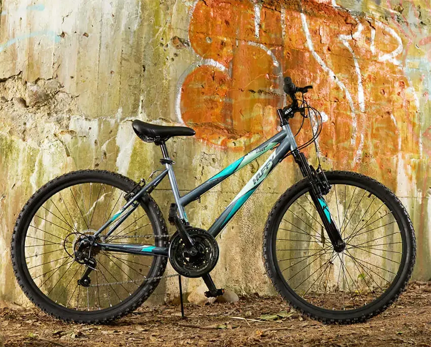 recreational huffy bike in front of a colorful wall