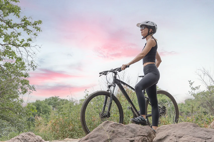 woman standing next to a tommaso gran sasso mountain bike