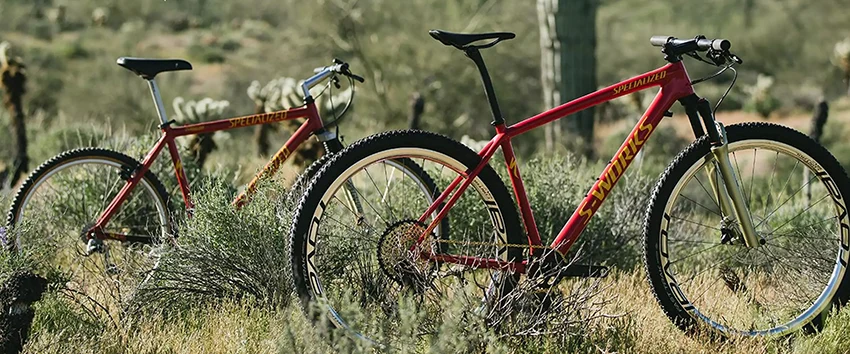 two red specialized mountain bikes