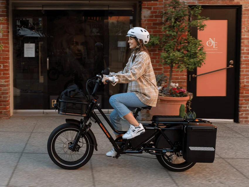 woman riding the rad power bikes radwagon 5 electric cargo bike